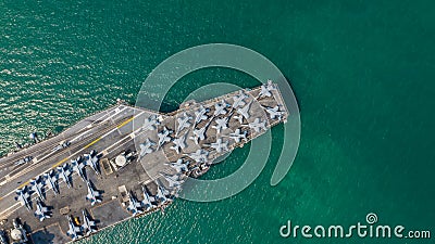 Navy Nuclear Aircraft carrier, Military navy ship carrier full loading fighter jet aircraft, Aerial view Stock Photo