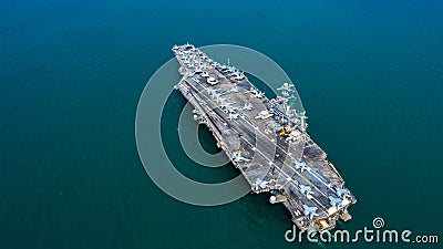 Navy Nuclear Aircraft carrier, Military navy ship carrier full loading fighter jet aircraft, Aerial view Stock Photo