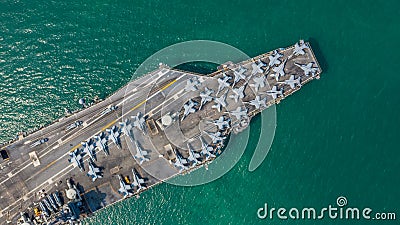 Navy Nuclear Aircraft carrier, Military navy ship carrier full loading fighter jet aircraft, Aerial view Stock Photo