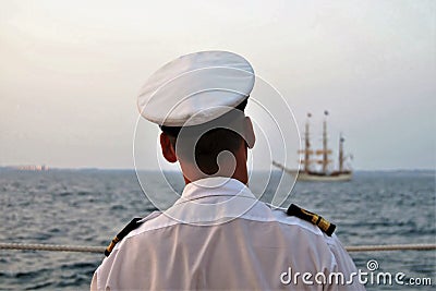 Navy officer watching the tall ship at the Tagus river Stock Photo