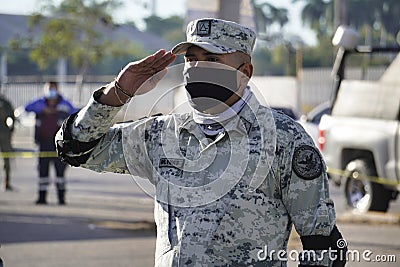 Navy soldier during civic event in honors of the flag of mexico, military greeting Editorial Stock Photo