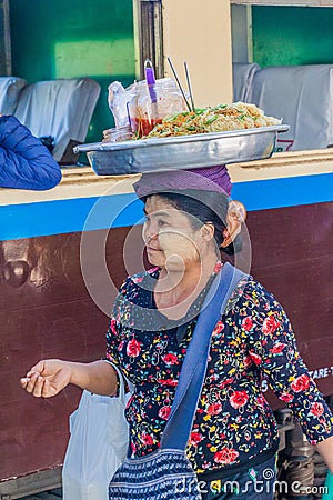 NAWNGHKIO, MYANMAR - NOVEMBER 30, 2016: Snack vendor on the train station in Nawnghkio Naunghkio, Naungcho or Nawngcho near Editorial Stock Photo