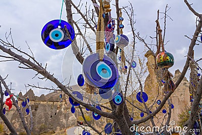 Nazar buncuk turkish amulets on a tree Stock Photo