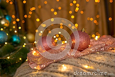 NChristmas balls coral color on the background of lights. Stock Photo