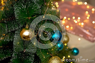 NChristmas tree decorated with blue and gold Christmas balls. Stock Photo