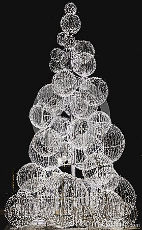Christmas tree illuminated with warm white light Stock Photo