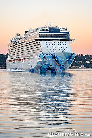 NCL cruise ship Norwegian Bliss turning in Elliott Bay Seattle at dawn Editorial Stock Photo