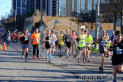 TORONTO, CANADA - May 5th, 2019 - 42nd Annual Toronto Marathon. People running through the city streets. Editorial Stock Photo