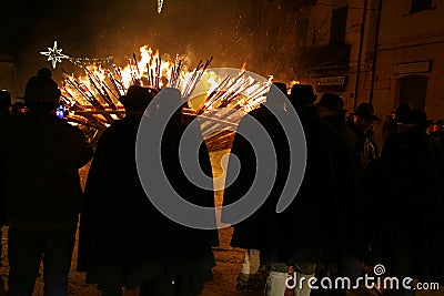 The `Ndocciata evocative rite of fire, with wooden torches over three meters high, heritage of Italy for tradition, Agnone, Italy Editorial Stock Photo