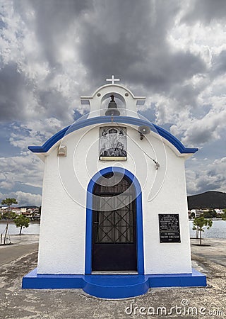 Nea Artaki, Evia Island, Greece. July 2019: Panoramic view of Little beautiful Greek church in blue and white colors on a sunny da Editorial Stock Photo