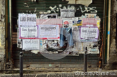 Neapolitan funeral notices posted on a lock up in a street, Naples Editorial Stock Photo