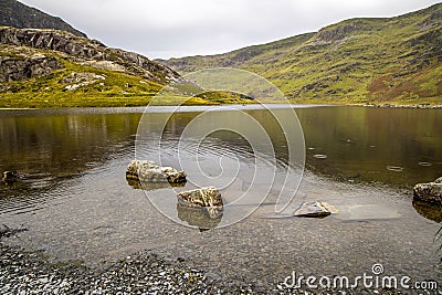 Llyn Cwmorthin with the ruin of Cwmorthin Terrace, the Compressor House and Stock Photo