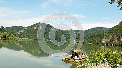Near Zvornik, Drina river with mountains and trees and blue sky in one summer day. Panoramic view, landscape, boat Stock Photo
