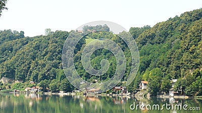Near Zvornik, Drina river with mountains and trees and blue sky in one summer day. Panoramic view, landscape, boat Stock Photo