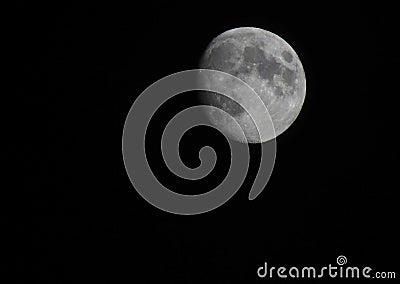 Nearly Full Moon with night sky Stock Photo