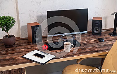 Neat desk and workstation in an office Stock Photo