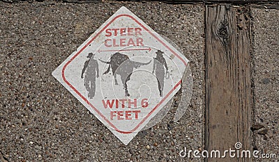 A sign on the sidewalk at the Fort Worth Stockyards in Fort Worth Texas. Stock Photo