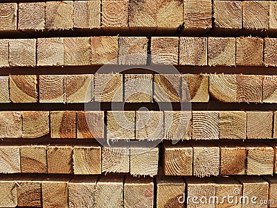 Neat softwood beam in stacks of texture for the background Stock Photo