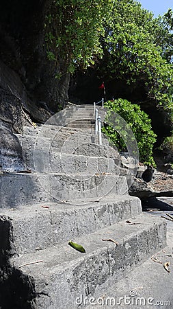 neat stone path. beautiful little street. streets in the middle of parks and gardens. cracked cement roads. Stock Photo