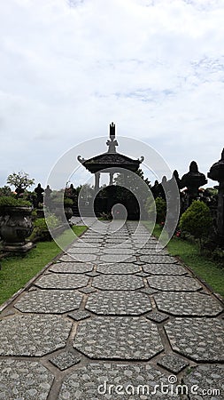 neat stone path. beautiful little street. streets in the middle of parks and gardens. cracked cement roads. Stock Photo