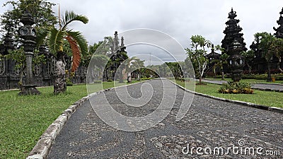 neat stone path. beautiful little street. streets in the middle of parks and gardens. cracked cement roads. Stock Photo