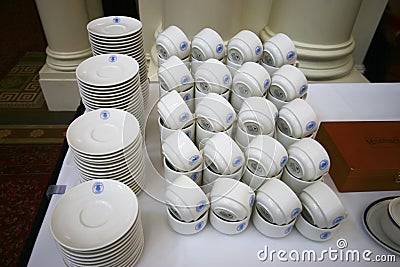 Neatly arranged array of tableware with blue parliamentarian logo for event in Parliament House of Victoria, Melbourne, Australia Editorial Stock Photo
