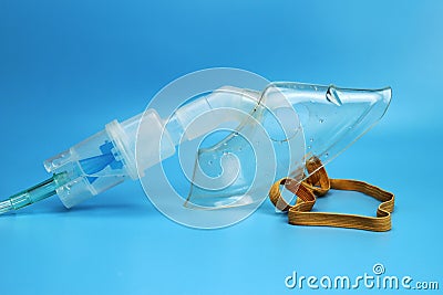 Nebulizer inhaler mask on a blue background Stock Photo