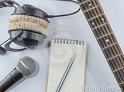 Neck guitar notebook in top view with music concept whitebackground Stock Photo