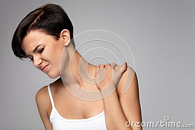 Neck Pain. Beautiful Woman Having Pain In Neck, Painful Feeling Stock Photo