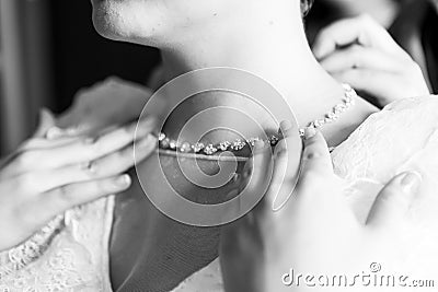 Necklace around the bride`s neck Stock Photo