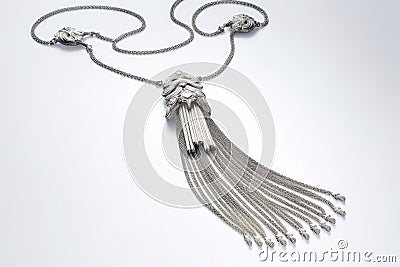 A Necklace With Long Chains With Tassels Or Fringe White Background. Generative AI Stock Photo