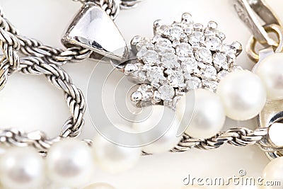 Necklaces, bracelet, diamonds and watch Stock Photo