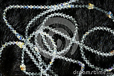 Necklaces over black animal skin background Stock Photo