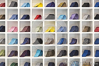 Neckties arranged in a grid shelf Stock Photo