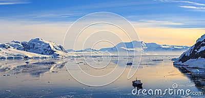 Neco bay surrounded by glaciers and cruise vessel drifting Stock Photo