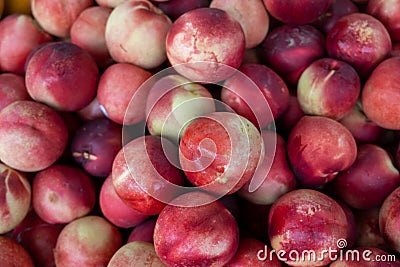 Nectarine, Prunus persica, smooth-skinned peach sold at the city market Stock Photo