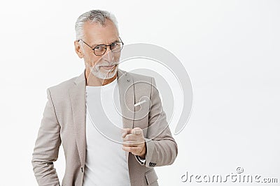 We need you man. Portrait of happy amused and tricky mature macho businessman in glasses and suit smiling looking and Stock Photo