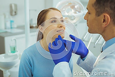 Cheerful woman looking at her stomatologist Stock Photo