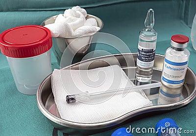 Needle for lumbar puncture together with anesthesia and antibiotic to extract cerebrospinal fluid in patients with Transverse Editorial Stock Photo