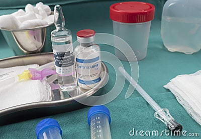 Needle for lumbar puncture together with anesthesia and antibiotic to extract cerebrospinal fluid in patients with Transverse Editorial Stock Photo