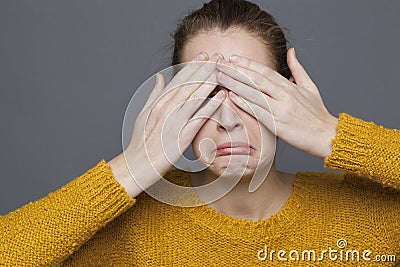 Negative feeling concept for sad 20s girl Stock Photo