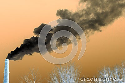 Negative image of an industrial pipe from which smoke goes to the sky above the trees without foliage. Concept pollution of the en Stock Photo