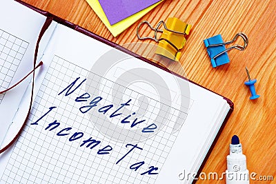 Negative Income Tax NIT inscription on the piece of paper Stock Photo