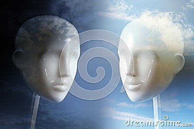 Negative versus positive thinking and emotion, psychology concept shown with two neutral colored mannequin heads and corresponding Stock Photo