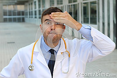 Negligent doctor realising an error Stock Photo