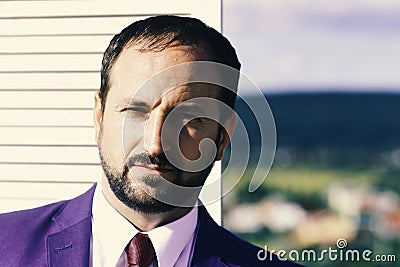 Negotiation and business concept. Businessman wears smart suit and tie on wooden wall Stock Photo