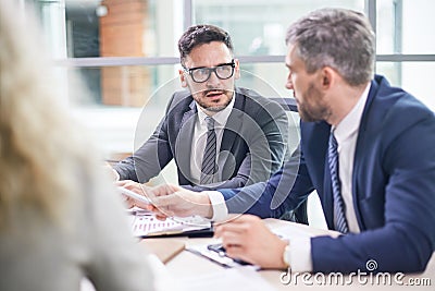 Negotiations of Bearded Business Partners Stock Photo