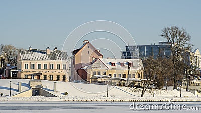 Neighborhood of old houses and modern buildings in winter. Retro versus modern style. Contrast in architecture. Stock Photo