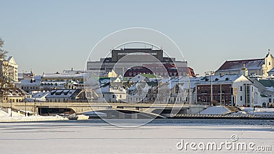 Neighborhood of old houses and modern buildings in winter. Retro versus modern style. Contrast in architecture. Stock Photo