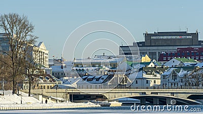 Neighborhood of old houses and modern buildings in winter. Retro versus modern style. Contrast in architecture. Stock Photo